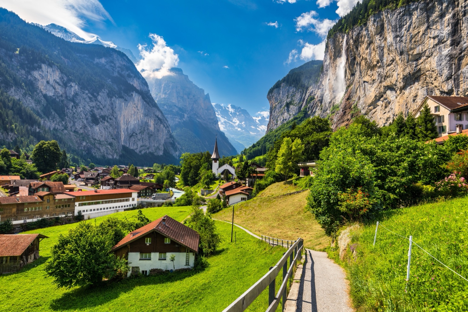 The Lauterbrunnen valley with the Staubbach waterfall and the village church